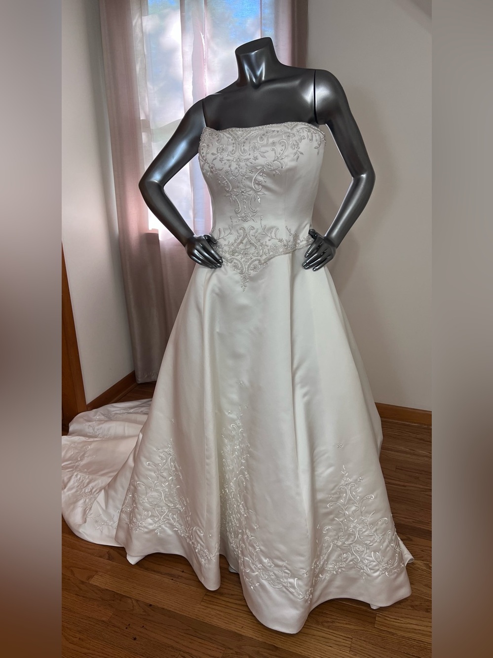 Mon Cheri ivory Strapless Bridal Gown basque waist and structured Bodice.